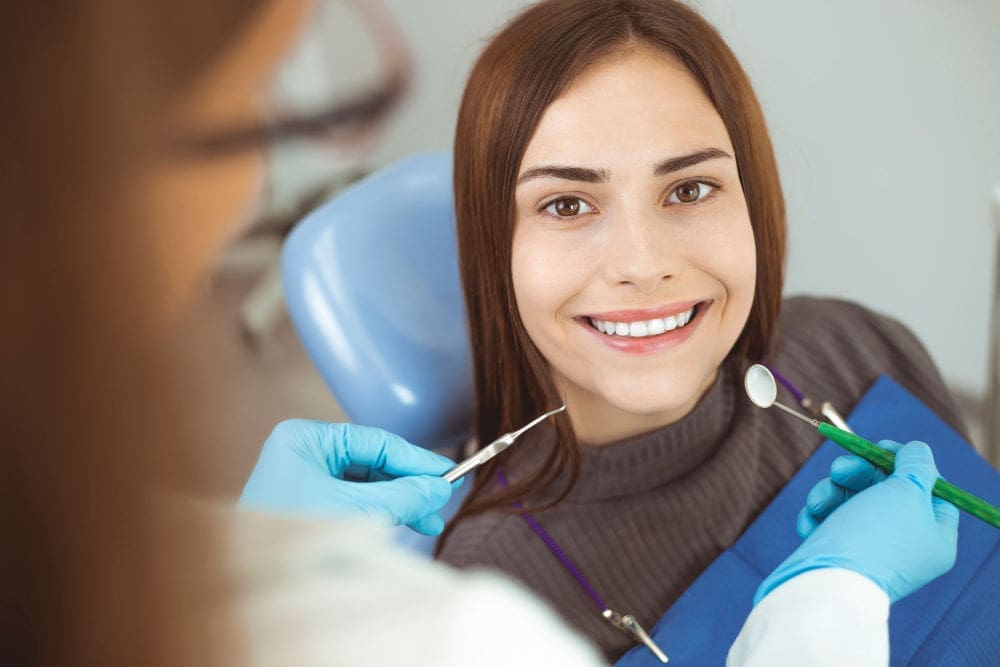 Dentist In Melrose | female patient smiling