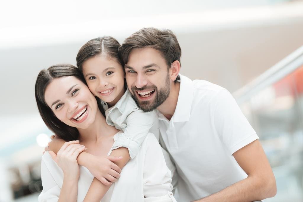 Melrose family dentistry | Happy family smiling.