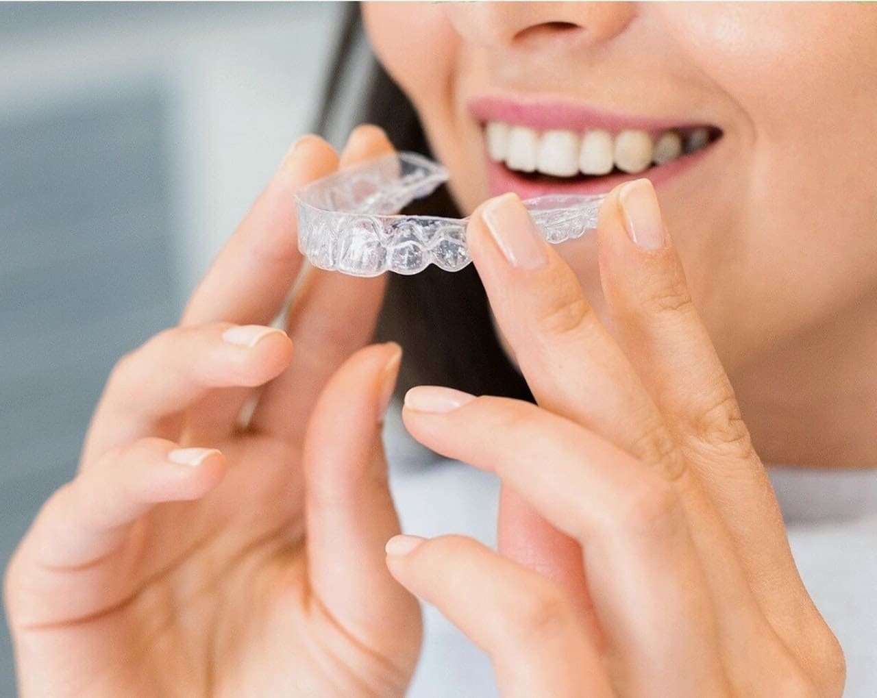 Close-up view of Invisalign clear aligners, designed to straighten teeth discreetly.