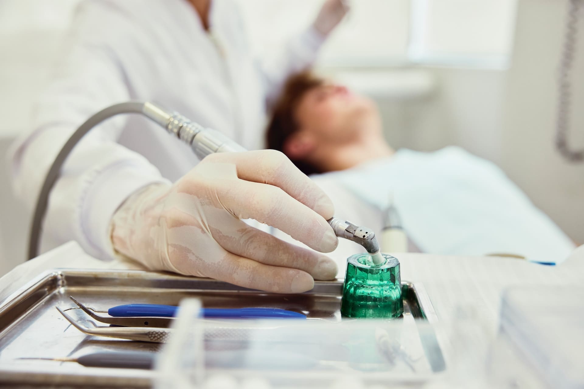 A person undergoing Periodontal Therapy, with a dentist treating their gums.