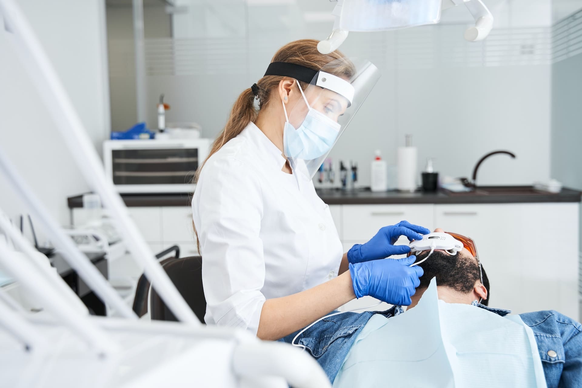 Dentist performing a dental exam on a patient