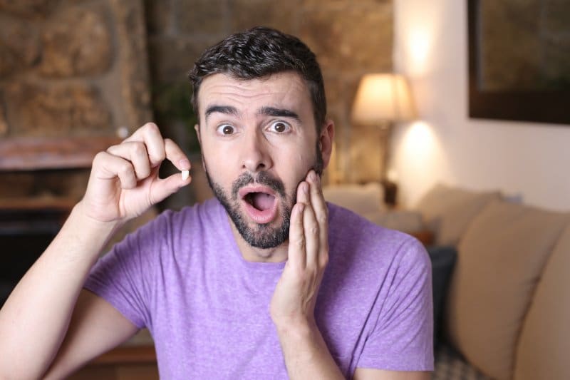 Patient shocked and looking at a knocked-out tooth