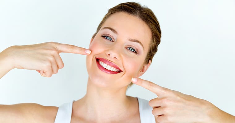 Woman after teeth whitening in Melrose