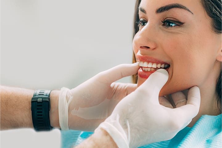 Dentist looking at patient’s mouth