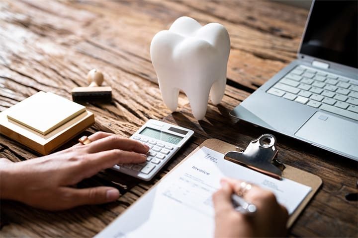 Patient in Melrose budgeting for Dental implants.