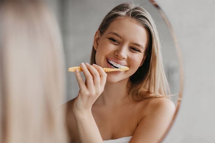 Woman brushing her teeth
